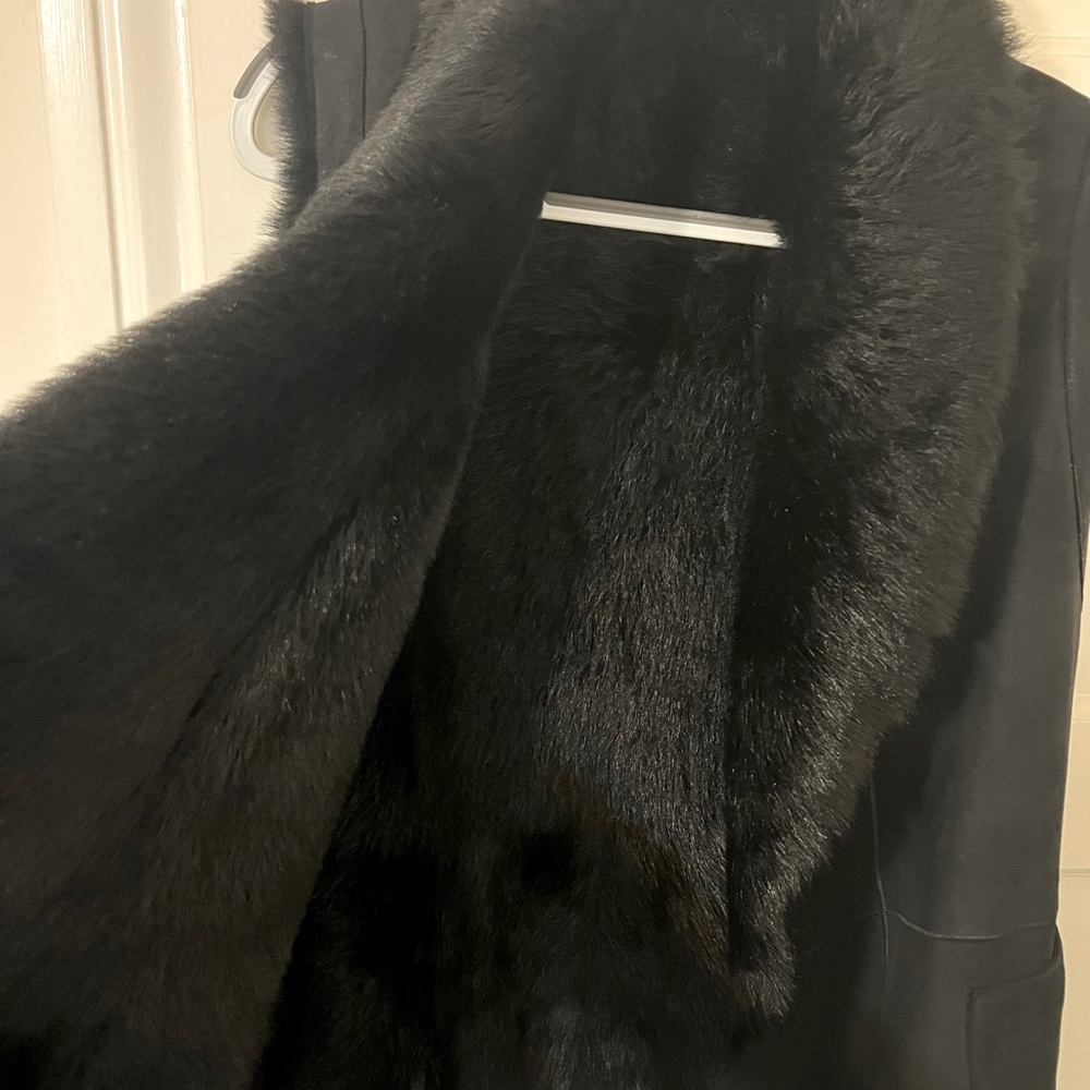 This is a small sized, a warm shearling vest. Can wear two sides